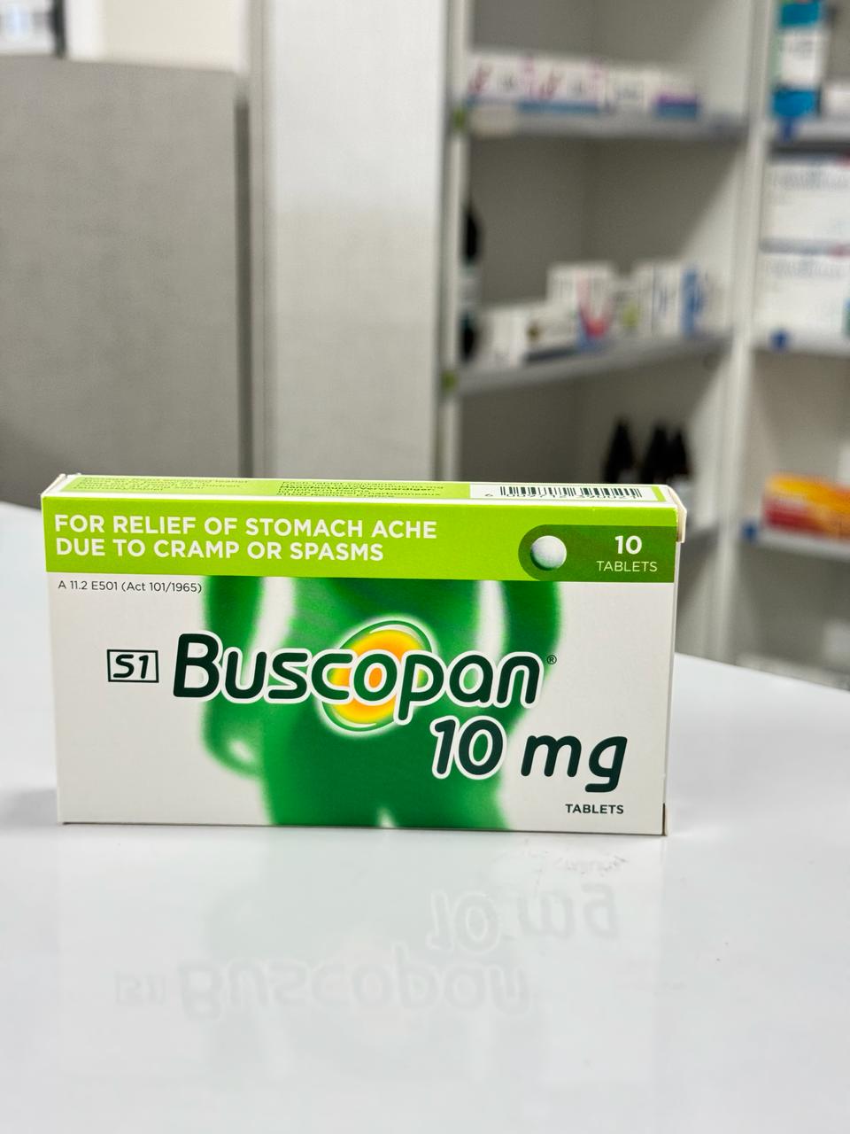 Box of Buscopan 10 mg tablets on a surface with a blurred background