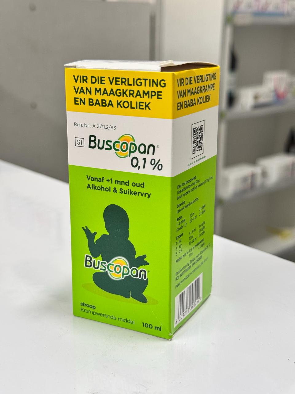 Box of Buscopan 0.1% on a white surface with a blurred background