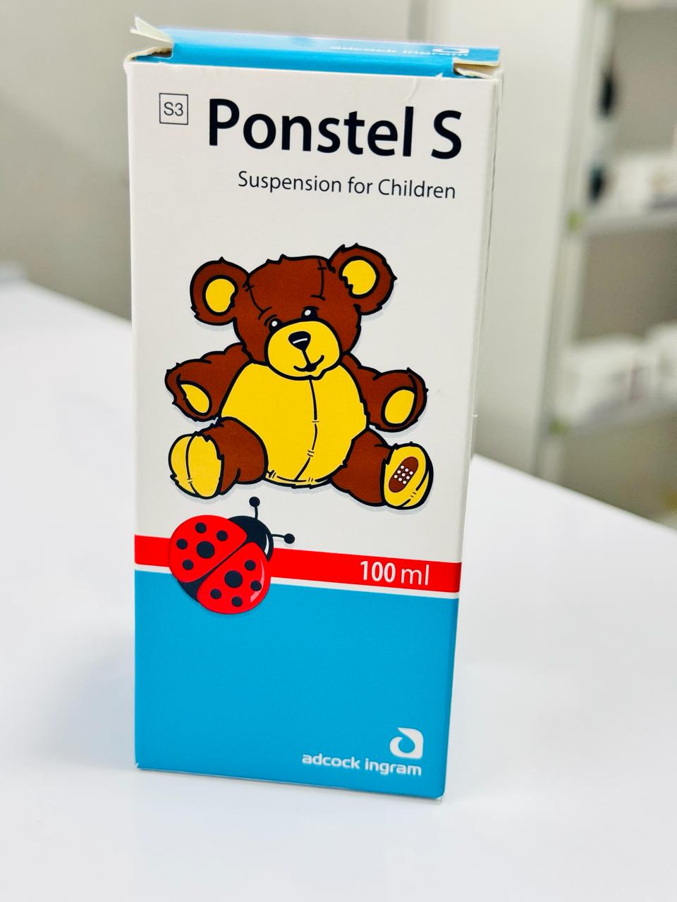 Ponstel S packaging for children with a teddy bear and ladybug design on a white surface.