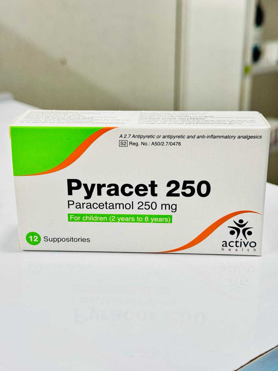 Box of Pyracet 250 Paracetamol suppositories with Activo Health logo on a white surface.