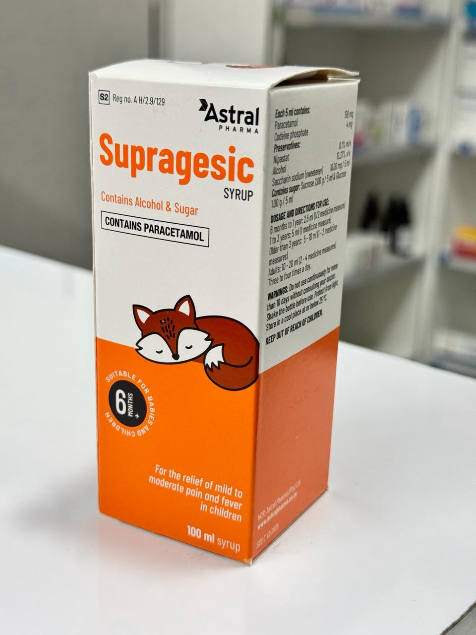 Supragesic syrup packaging with a fox illustration on a white surface